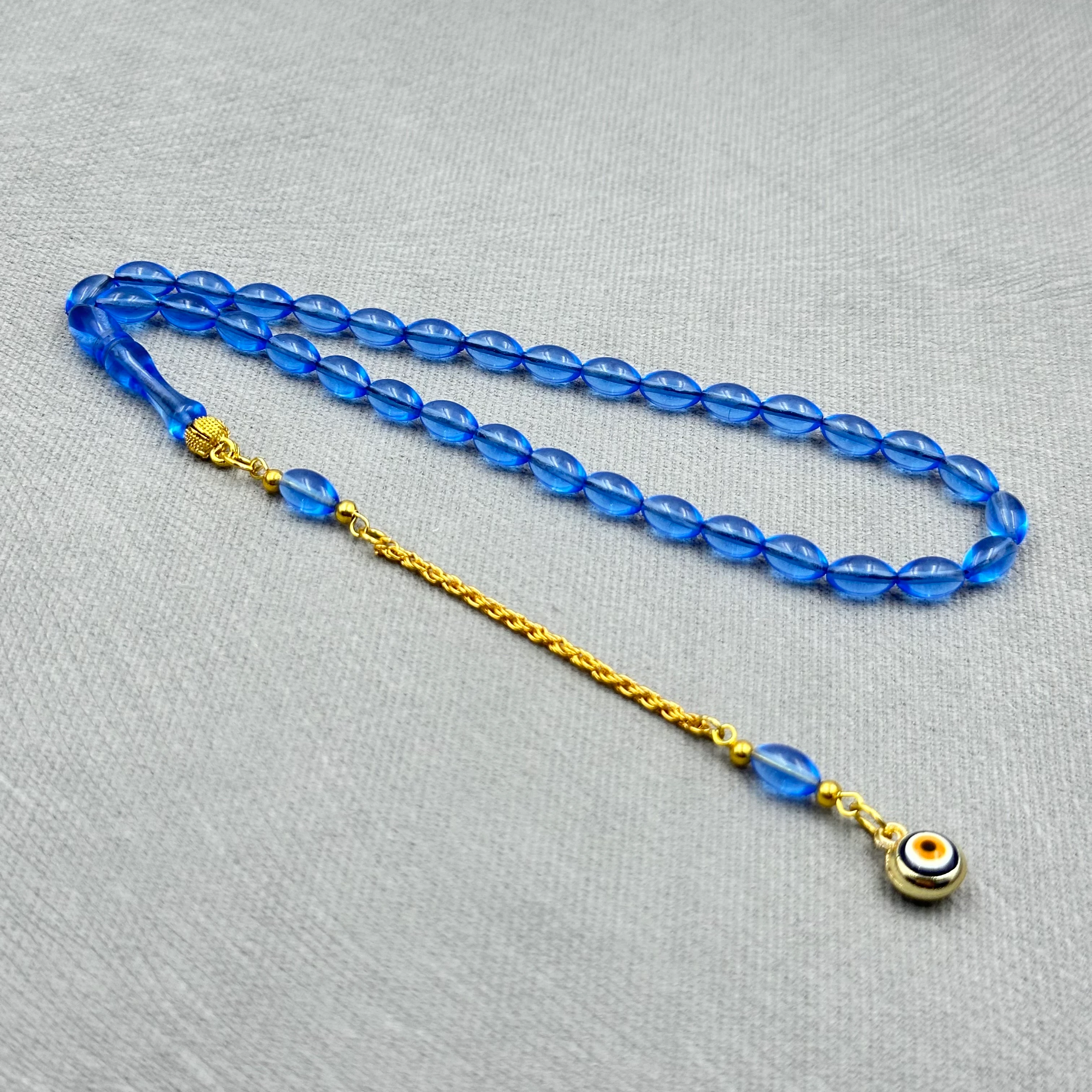 Pirinç Püsküllü Nazar Boncuğu Detaylı Bilek Boy Mavi Uçak Camı Tespih